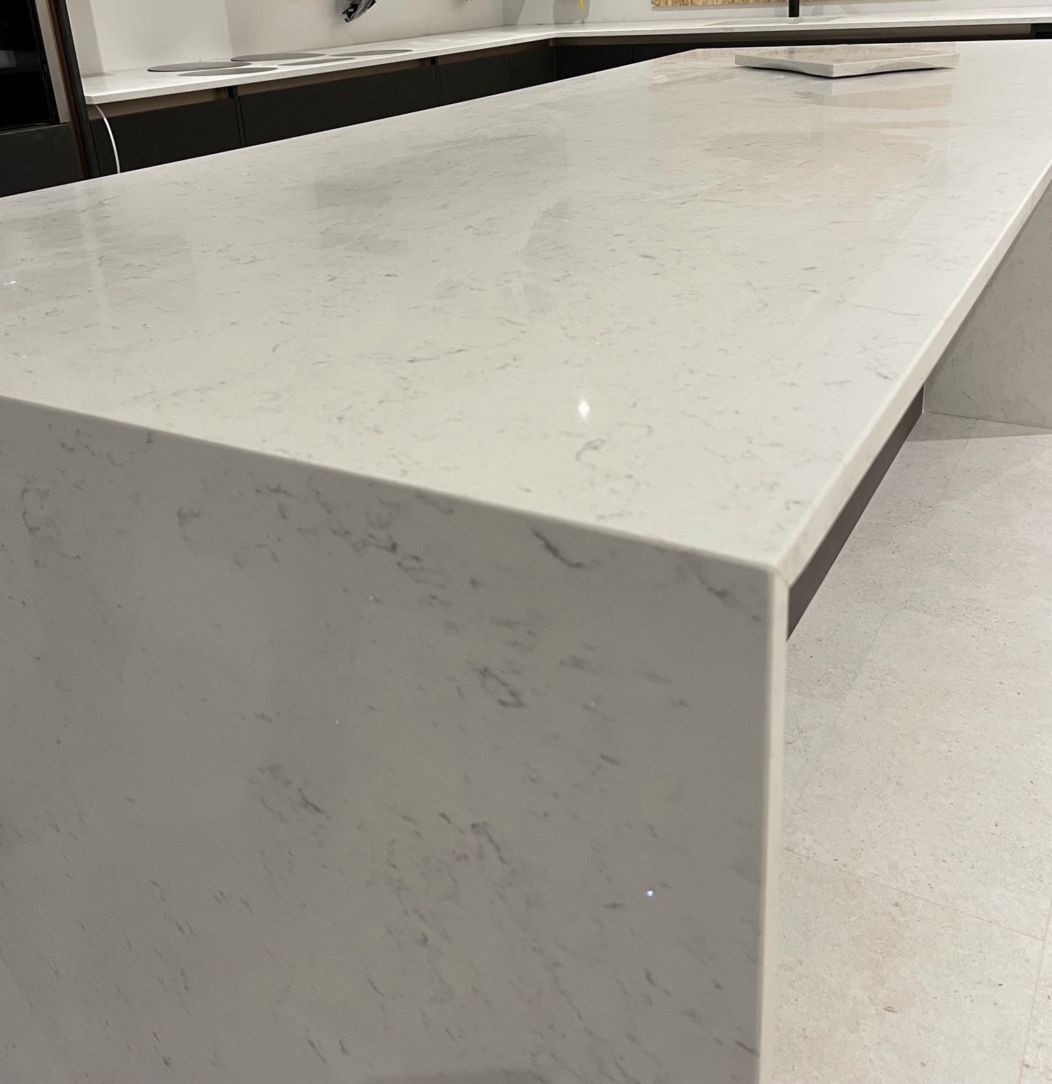 Carrara Shimmer Island with mitred waterfalls. Project: Standon 